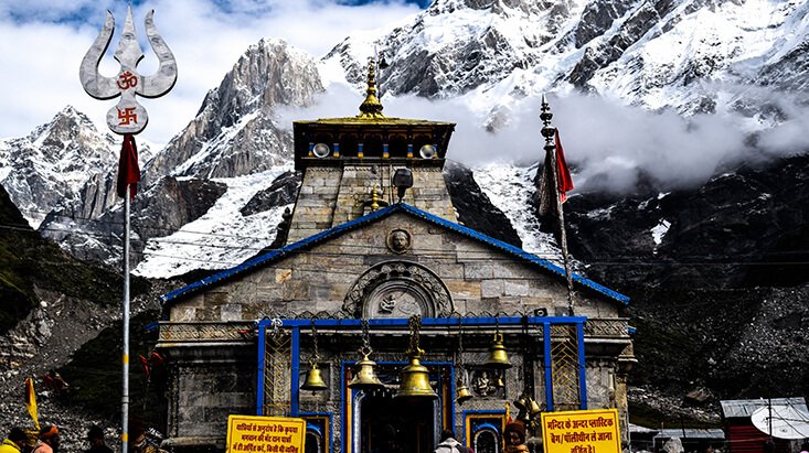 Kedarnath Temple surrounded by snowy peaks